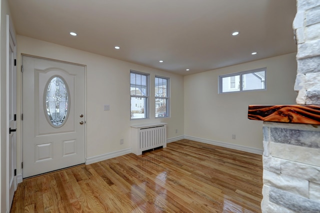 702 King St, Stratford, CT 06614 - foyer entrance featuring radiator, light wood-style flooring, baseboards, and recessed lighting