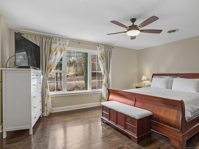 bedroom featuring dark hardwood / wood-style floors and ceiling fan