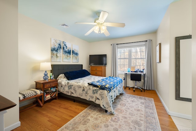 bedroom with wood-type flooring and ceiling fan