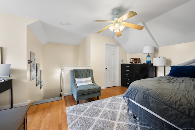 bedroom with vaulted ceiling, hardwood / wood-style floors, and ceiling fan