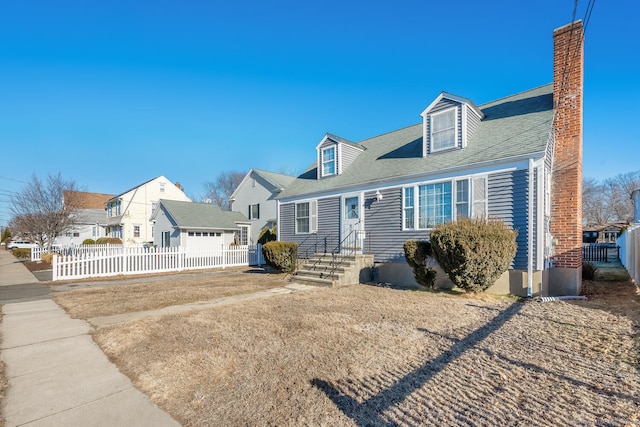 cape cod house featuring a garage