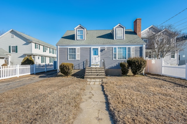 new england style home with a front lawn