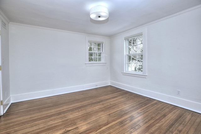 unfurnished room featuring crown molding and dark hardwood / wood-style flooring