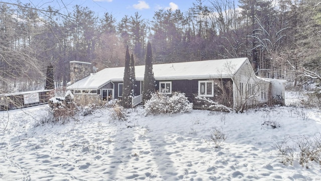 view of snow covered house