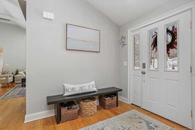 foyer entrance with hardwood / wood-style flooring and lofted ceiling