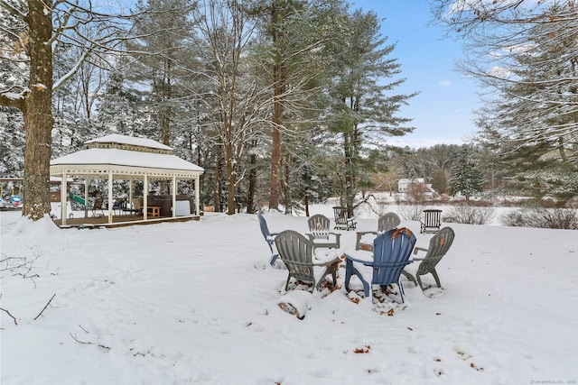 yard layered in snow featuring a gazebo