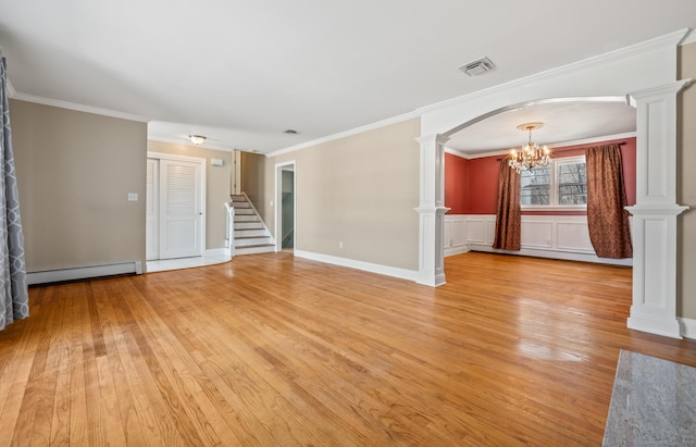 unfurnished living room with ornate columns, ornamental molding, light wood-type flooring, and a baseboard heating unit