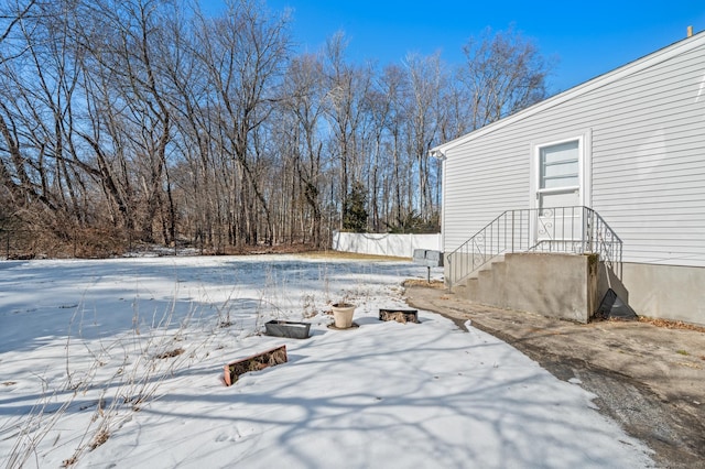 view of yard layered in snow