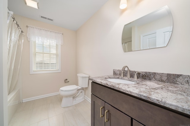 full bathroom featuring vanity, shower / tub combo, and toilet