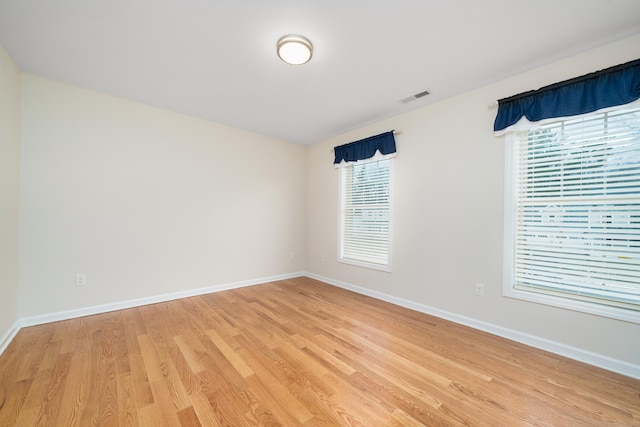 unfurnished room featuring light hardwood / wood-style floors