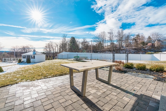 view of patio with an outbuilding