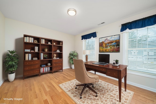 home office with light wood-type flooring