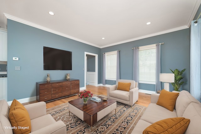 living room featuring ornamental molding and light hardwood / wood-style floors