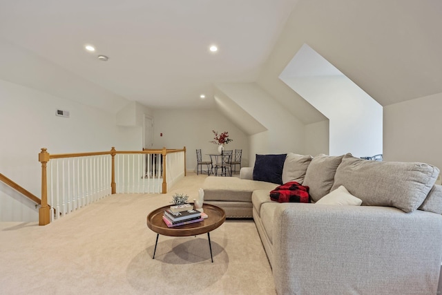 living room with recessed lighting, visible vents, vaulted ceiling, and light colored carpet