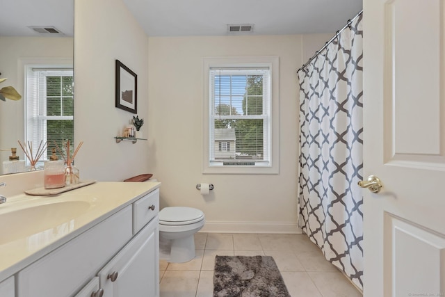 full bath featuring baseboards, vanity, visible vents, and tile patterned floors