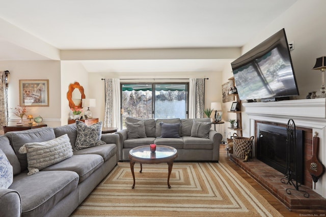 957A Heritage Vlg, Southbury, CT 06488 - living room with light wood finished floors and a fireplace
