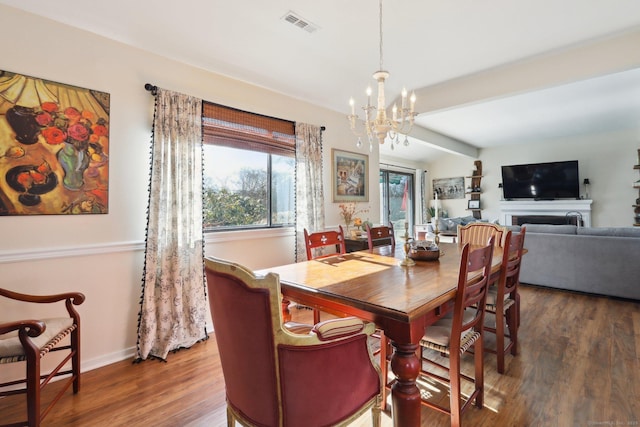957A Heritage Vlg, Southbury, CT 06488 - dining area featuring a chandelier, wood finished floors, baseboards, and beam ceiling