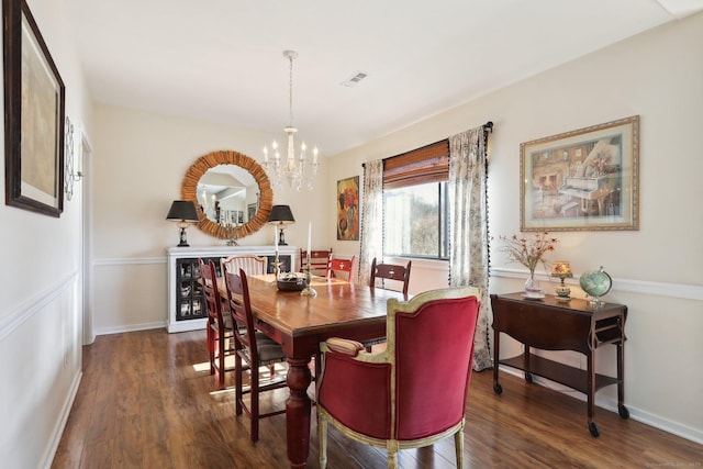 957A Heritage Vlg, Southbury, CT 06488 - dining space featuring a chandelier, dark wood-style flooring, and baseboards