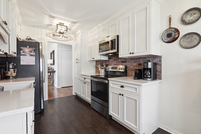 957A Heritage Vlg, Southbury, CT 06488 - kitchen featuring appliances with stainless steel finishes, backsplash, white cabinets, and light countertops