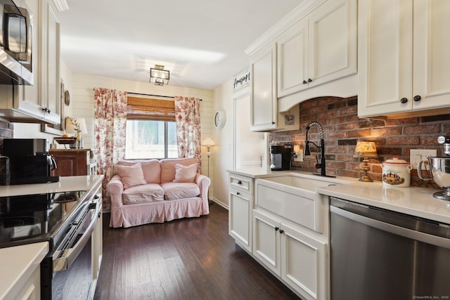 957A Heritage Vlg, Southbury, CT 06488 - kitchen with stainless steel dishwasher, black microwave, electric stove, a sink, and light countertops