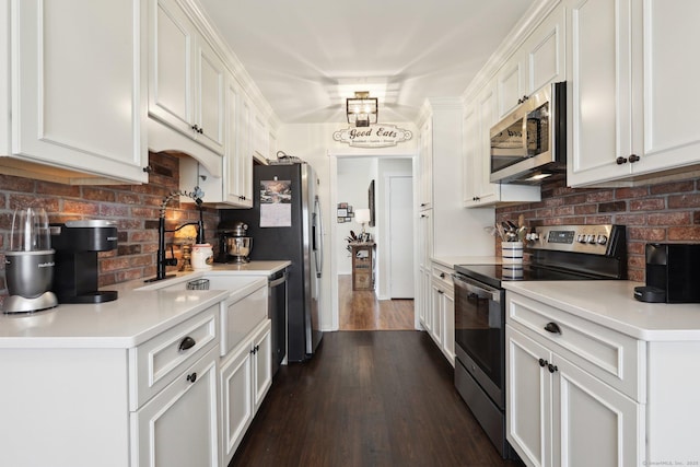 957A Heritage Vlg, Southbury, CT 06488 - kitchen with appliances with stainless steel finishes, backsplash, white cabinetry, and a sink