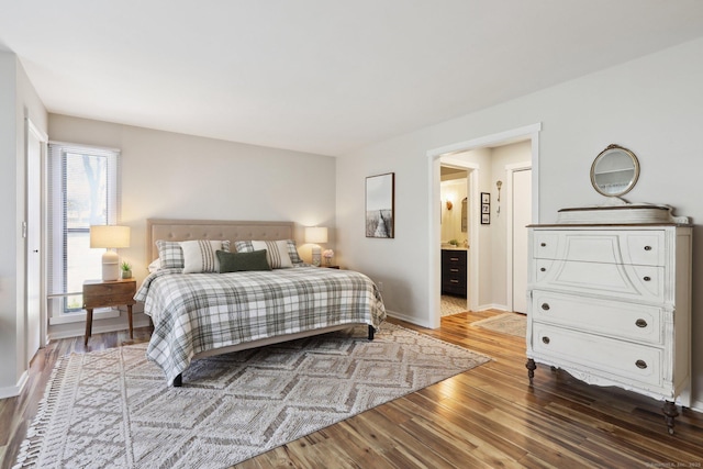 957A Heritage Vlg, Southbury, CT 06488 - bedroom with wood finished floors, baseboards, and ensuite bath