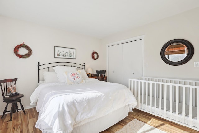 957A Heritage Vlg, Southbury, CT 06488 - bedroom with a closet, wood finished floors, and baseboards