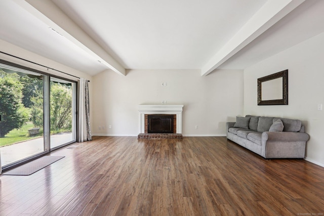 957A Heritage Vlg, Southbury, CT 06488 - unfurnished living room with beam ceiling, wood finished floors, a fireplace, and baseboards