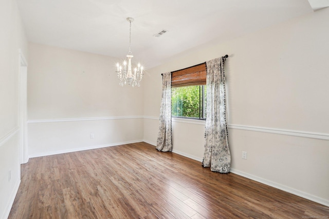 957A Heritage Vlg, Southbury, CT 06488 - spare room featuring a chandelier, wood finished floors, and baseboards