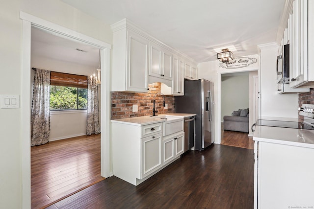 957A Heritage Vlg, Southbury, CT 06488 - kitchen featuring a chandelier, appliances with stainless steel finishes, tasteful backsplash, and dark wood-type flooring