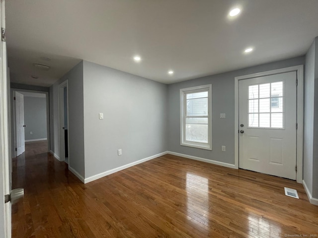 foyer with dark hardwood / wood-style floors