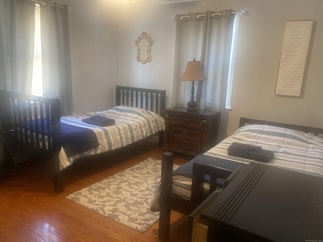 bedroom with hardwood / wood-style floors