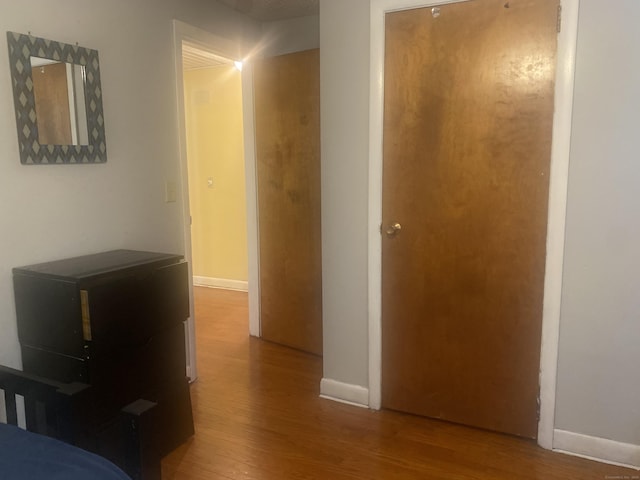 hallway featuring hardwood / wood-style flooring