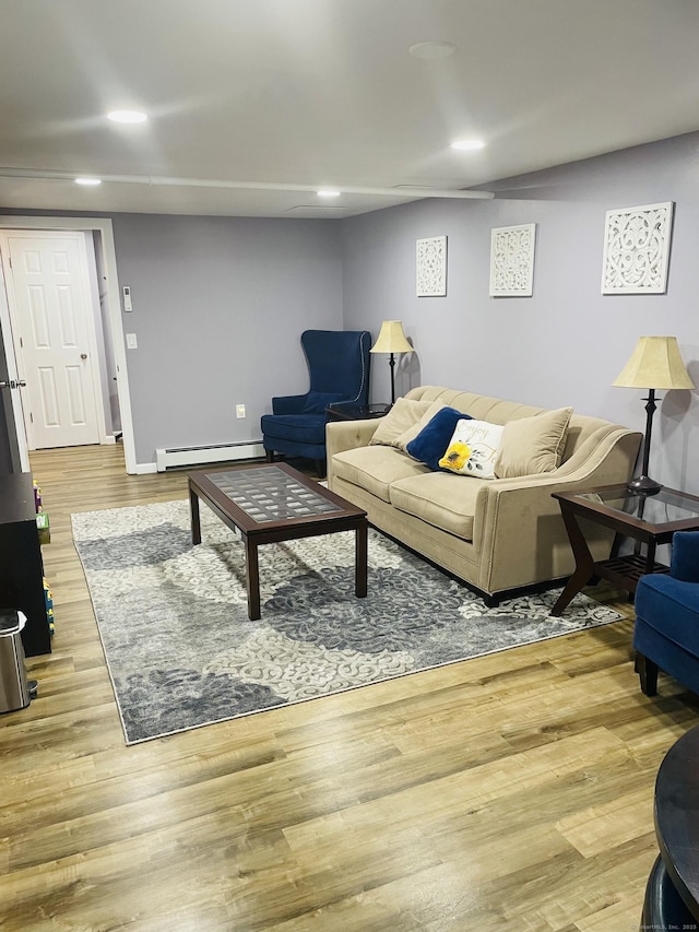 living room featuring light hardwood / wood-style floors and baseboard heating