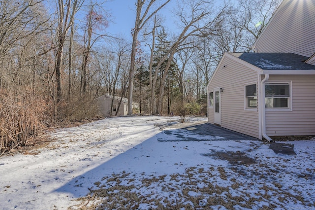 view of yard covered in snow