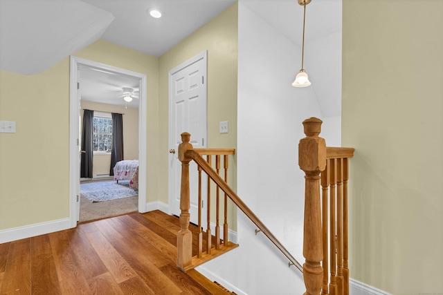 corridor with hardwood / wood-style floors