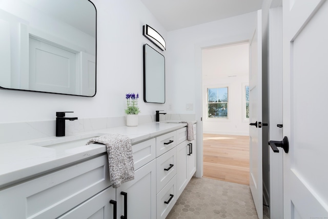 bathroom with vanity and hardwood / wood-style floors