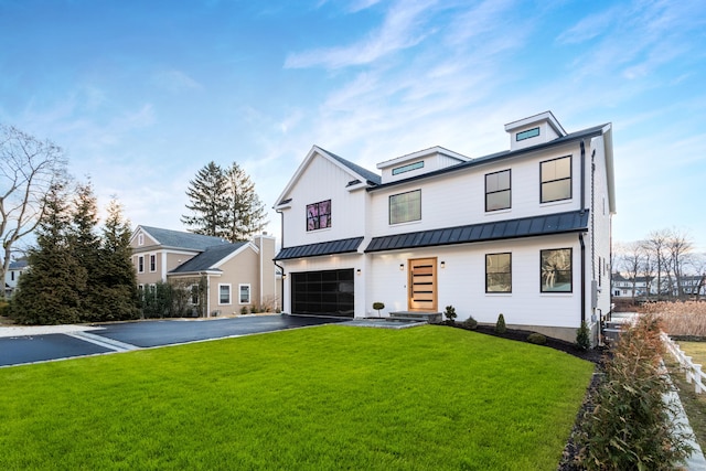 modern farmhouse style home with a garage and a front lawn