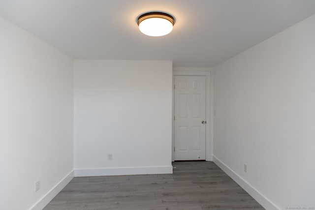 empty room with wood-type flooring