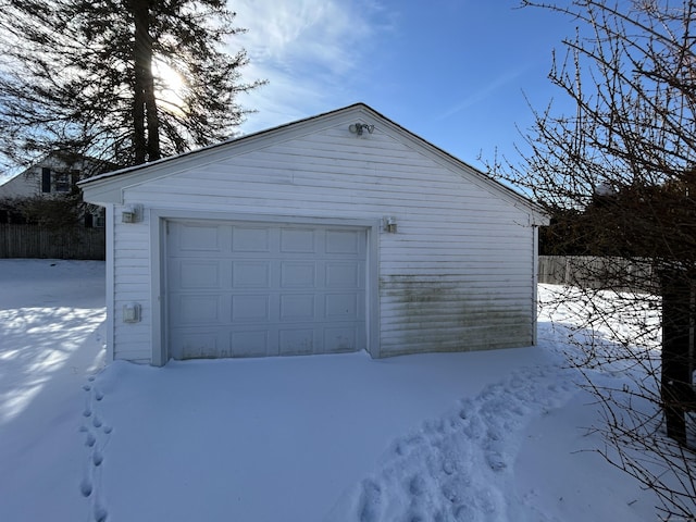 view of snow covered garage