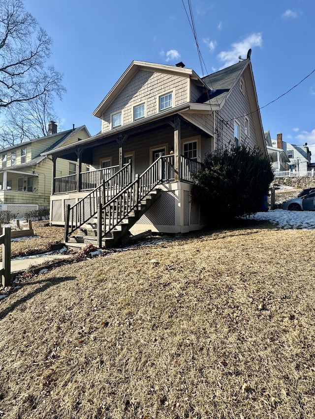 back of property featuring a porch