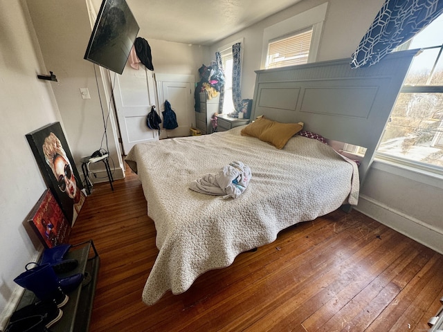 bedroom featuring dark wood-type flooring