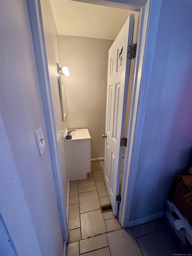 bathroom with sink and tile patterned flooring