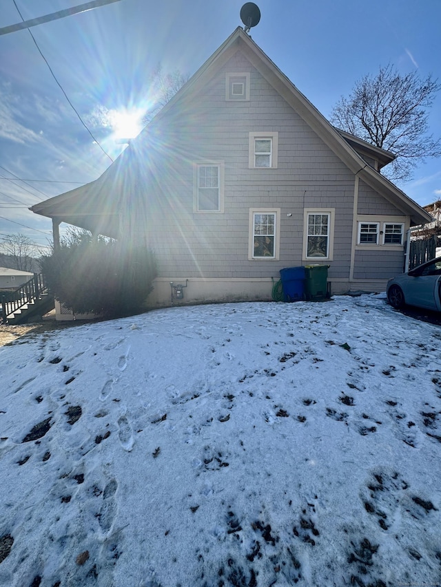 view of snow covered house