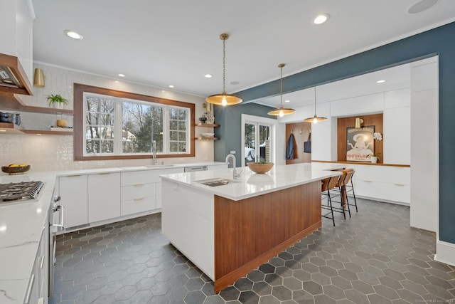 kitchen featuring modern cabinets, a sink, and open shelves