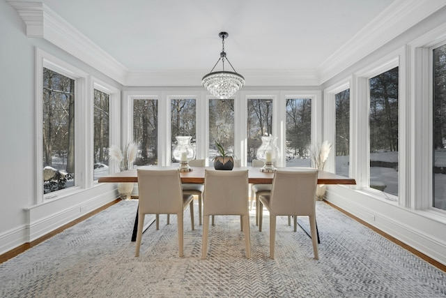 sunroom with a notable chandelier