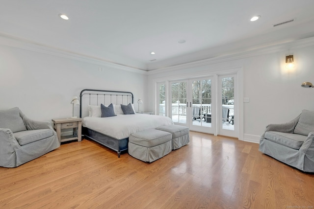 bedroom featuring access to outside, french doors, visible vents, and crown molding