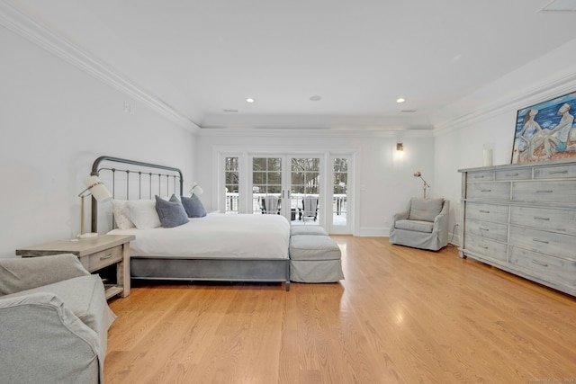 bedroom with light wood-type flooring, access to exterior, ornamental molding, and french doors