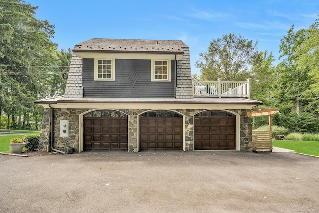 garage with aphalt driveway