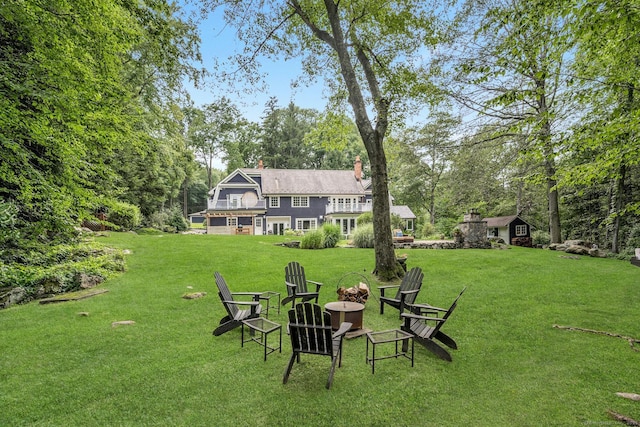 view of yard with a fire pit